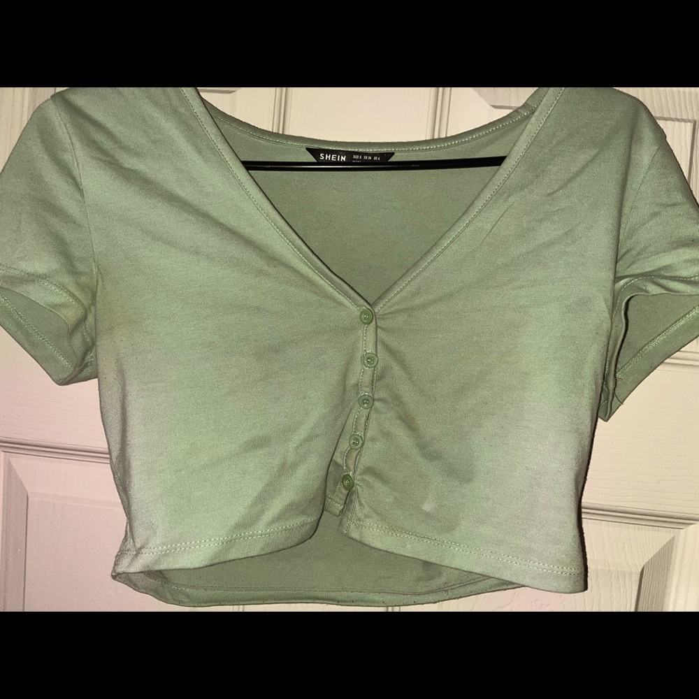 green and white crop top.